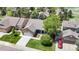 Charming home featuring a well-manicured lawn, mature trees, and a two-car garage at 20855 Omaha Ave, Parker, CO 80138