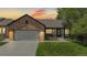 Charming single-story brick home with a well-manicured lawn and an attached two-car garage at 20855 Omaha Ave, Parker, CO 80138