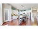 Modern kitchen features an island with barstool seating and stainless steel appliances at 20855 Omaha Ave, Parker, CO 80138