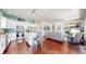 Open-concept kitchen and living space with fireplace and tv at 20855 Omaha Ave, Parker, CO 80138