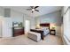 Inviting main bedroom with a dark wood bed frame, ceiling fan, and light gray colored walls at 20855 Omaha Ave, Parker, CO 80138