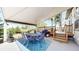 Covered patio featuring a dining table and seating, a grill, and stairs leading to the backyard at 20855 Omaha Ave, Parker, CO 80138
