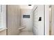 Modern tiled shower with built in bench, glass block window, and rainfall shower head at 20855 Omaha Ave, Parker, CO 80138