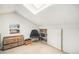 Finished attic space with natural light and built in storage with additional furniture at 3726 Decatur St, Denver, CO 80211