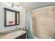 Updated bathroom with tiled shower and sleek vanity providing a clean and modern feel at 3726 Decatur St, Denver, CO 80211