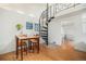 Cozy dining area featuring wooden table and chairs with a spiral staircase nearby at 3726 Decatur St, Denver, CO 80211