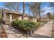 Charming bungalow-style home with manicured landscaping and inviting front porch at 3726 Decatur St, Denver, CO 80211