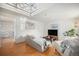 Bright living room featuring skylight, hardwood floors and modern decor at 3726 Decatur St, Denver, CO 80211
