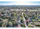 Aerial view of neighborhood featuring mature trees, houses and community amenities at 7785 Westview Dr, Lakewood, CO 80214