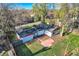 View of home and backyard, partially fenced, with grassy area and mature trees at 7785 Westview Dr, Lakewood, CO 80214