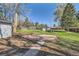 Spacious backyard with grass, trees, and shed at 7785 Westview Dr, Lakewood, CO 80214