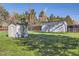 Private backyard featuring a storage shed, secure fencing, and ample green space for outdoor activities and relaxation at 7785 Westview Dr, Lakewood, CO 80214
