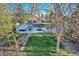 Charming single-story home with green lawn and mature trees at 7785 Westview Dr, Lakewood, CO 80214