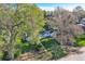 Charming single-story home on green lawn with mature trees at 7785 Westview Dr, Lakewood, CO 80214