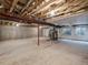 Unfinished basement with concrete walls, exposed ceiling beams, and available utilities, ready for customization at 8579 S Miller Way, Littleton, CO 80127