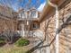 Inviting townhouse front yard with manicured lawn and charming white picket fence showcasing suburban appeal at 8579 S Miller Way, Littleton, CO 80127