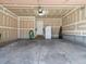 Spacious garage with side door, storage and concrete floor at 8579 S Miller Way, Littleton, CO 80127