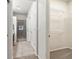 Hallway view of a walk-in closet, a shower and dual sinks at 8579 S Miller Way, Littleton, CO 80127