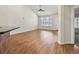 Spacious living room with hardwood floors and plantation shutters provides a bright and inviting atmosphere at 8579 S Miller Way, Littleton, CO 80127