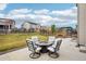 Backyard patio with a fire pit and outdoor furniture, surrounded by well-maintained grass at 12797 Clearview St, Firestone, CO 80504