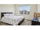 Bright bedroom with a large window offering neighborhood views at 12797 Clearview St, Firestone, CO 80504