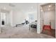 Bonus room with laundry area and bright neutral carpet at 12797 Clearview St, Firestone, CO 80504