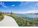 Paved path along the community lake provides a scenic route for walking and enjoying the natural beauty at 12797 Clearview St, Firestone, CO 80504