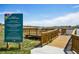 Community dock with lake access, featuring informational signage about lake usage at 12797 Clearview St, Firestone, CO 80504