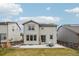 Home exterior with a spacious backyard, patio, and solar panels on the roof at 12797 Clearview St, Firestone, CO 80504