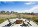 Cozy fire pit area with chairs, ideal for relaxing and socializing in the community at 12797 Clearview St, Firestone, CO 80504