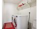 Laundry room with modern washer and dryer units, a deep sink, and storage shelving at 12797 Clearview St, Firestone, CO 80504
