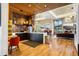Community lounge with wood floors, kitchen, dining and comfortable seating areas at 12797 Clearview St, Firestone, CO 80504