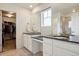 Main bathroom with double sink vanity, granite counters, and a walk-in closet at 12797 Clearview St, Firestone, CO 80504