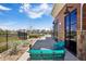 Relaxing outdoor patio with seating, stone accents, and views of the neighborhood at 12797 Clearview St, Firestone, CO 80504