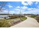 Scenic walking path by the lake with a pier, perfect for leisurely strolls and enjoying nature at 12797 Clearview St, Firestone, CO 80504