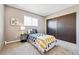 Bright bedroom with closet, carpeted floor, and a comfortable bed at 1001 W 112Th Ave # D, Westminster, CO 80234