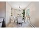 Dining room with a round table, carpeted floors, and sliding glass doors to the deck at 1001 W 112Th Ave # D, Westminster, CO 80234