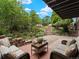 A backyard featuring comfortable outdoor furniture and lush landscaping, perfect for relaxation at 1075 Dudley St, Lakewood, CO 80215