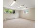 Spacious basement area with large windows allowing for lots of natural light at 1075 Dudley St, Lakewood, CO 80215