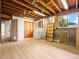 Spacious basement with exposed ceiling, storage, and access to stairs at 1075 Dudley St, Lakewood, CO 80215