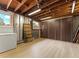 Spacious basement with exposed ceiling, storage, and access to backyard at 1075 Dudley St, Lakewood, CO 80215