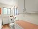 Bathroom with vanity, soft lighting, and ample cabinet space at 1075 Dudley St, Lakewood, CO 80215