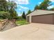 A detached two-car garage featuring an adjacent bridge, offering convenient and secure parking at 1075 Dudley St, Lakewood, CO 80215