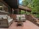 An outdoor patio with comfortable seating and elevated platform, creating a cozy and inviting space at 1075 Dudley St, Lakewood, CO 80215