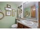 Quaint bathroom with decorative mirrors, and granite countertop at 15149 E Princeton Pl # B, Aurora, CO 80014
