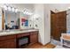 Bathroom with granite countertops, double sinks, and a shower at 15149 E Princeton Pl # B, Aurora, CO 80014