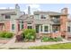 Charming brick townhome with well-maintained landscaping and inviting entrance at 15149 E Princeton Pl # B, Aurora, CO 80014