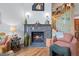 Elegant fireplace with stone surround and adjacent staircase at 15149 E Princeton Pl # B, Aurora, CO 80014