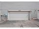 Attached one car garage with painted white door and overhead lighting at 15149 E Princeton Pl # B, Aurora, CO 80014