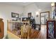 Inviting hallway with hardwood floors and charming decor leads to other rooms at 15149 E Princeton Pl # B, Aurora, CO 80014